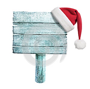 Frozen wooden sign with red Santa's hat