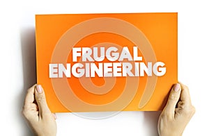 Frugal Engineering is the process of reducing the complexity and cost of a good and its production, text concept on card for