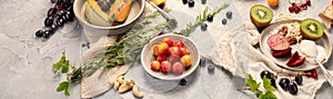 Fruit assortment served on light gray table