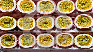 Fruit backdrop with sliced maracujas neatly presented at market