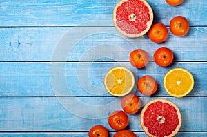 Fruit background closeup- grapefruit, apples, oranges and tangerines