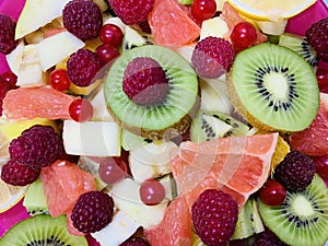Fruit background photo.Fruit salad close-up. Variety of colorful fruits. Fruit platter.