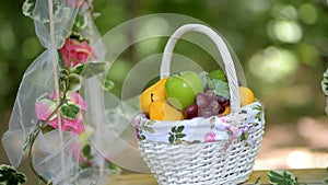 Fruit basket flowers on a swing wedding entourage