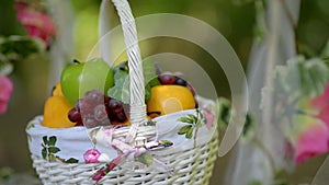 Fruit basket flowers on a swing wedding entourage