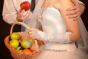 Fruit basket in the hands of the bride