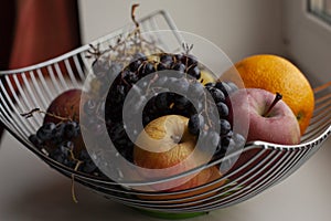 Fruit basket, vitamin cocktail, apples, grapes, and other fruits