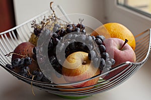 Fruit basket, vitamin cocktail, apples, grapes, and other fruits