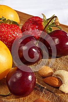 Fruit and berries on a cutting board proper food preparation home cooking foodphoto photo