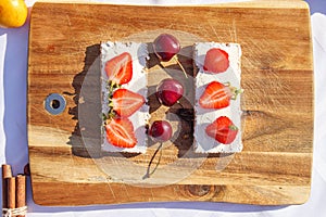 Fruit and berries on a cutting board proper food preparation home cooking foodphoto photo