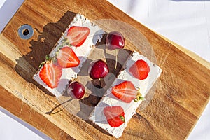 Fruit and berries on a cutting board proper food preparation home cooking foodphoto photo