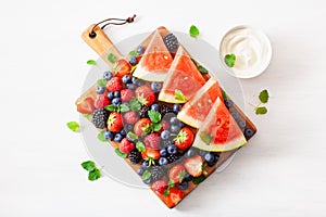 Fruit and berry platter over white. blueberry, strawberry, raspberry, blackberry, watermelon