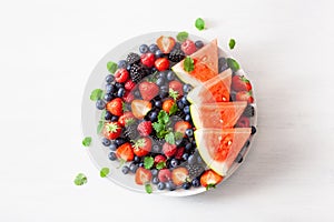 Fruit and berry platter over white. blueberry, strawberry, raspberry, blackberry, watermelon