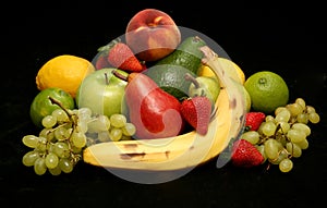 Fruit on black satin background