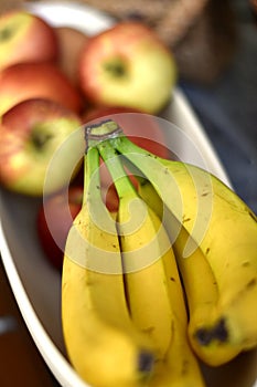 Fruit bowl with bananas and apples