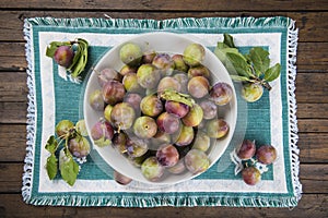 Fruit bowl with greengage plums