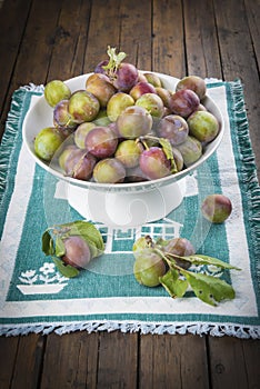 Fruit bowl with greengage plums