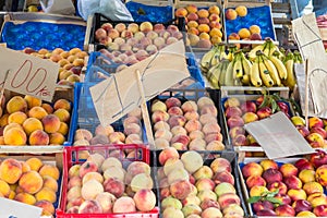 Fruit boxes with plums and peaches