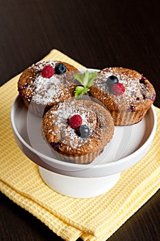 Fruit and bran muffins with fresh blueberries and raspberries