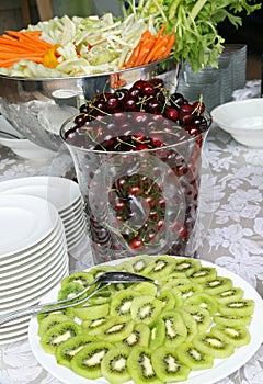 Fruit buffet mixed with kiwi green and red cherries