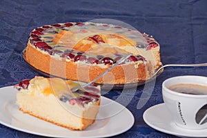 Fruit cake with coffee and cake plate