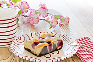 A fruit cake with a fork