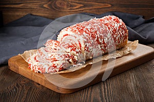 Fruit cake roll on wooden table