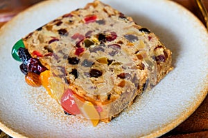 Fruit cake on a white plate, close-up
