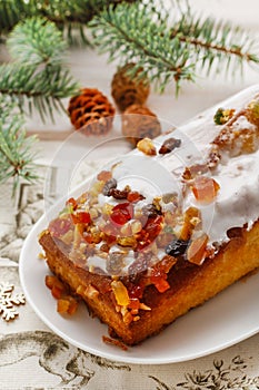 Fruit cakewith dried fruits and nuts in christmas setting
