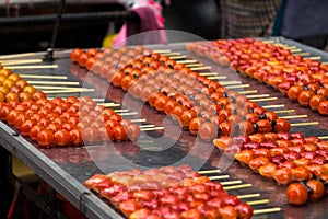 Fruit candy look so bright and vivid and delicious selling by street vendor.