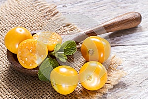 Fruit of cape gooseberry, uvilla on wooden background