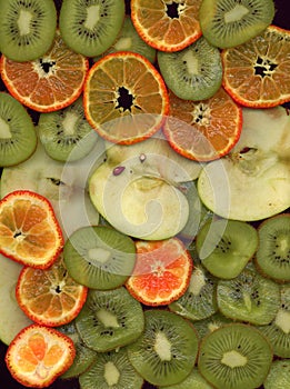 Fruit cocktail. apples, mandarins and kiwi fruit, cut into thin slices.