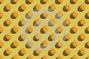 Fruit concept orange on a colored background, top view. Pattern