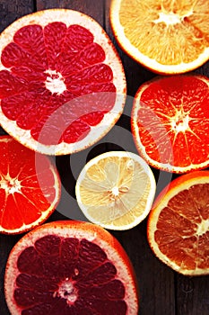 Fruit in a cut closeup, grapefruit, orange, lemon, tangerine, fruit background. rustic food. fruit. Fresh fruits.Mixed fruits back