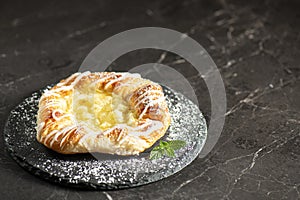 Fruit Danish with white fondant and icing sugar