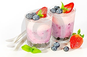 Fruit dessert with berries served in glass (berry cheesecake wit