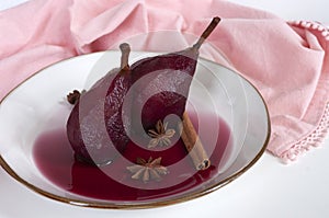 Fruit dessert, pear poached in red wine with cinnamon, italian kitchen, delicious.