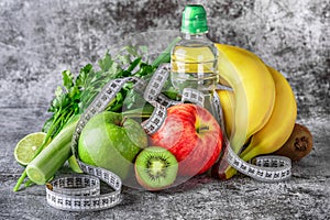 Fruit detox.Fresh green fruits vegetables on vintage background - concept for detoxification, diet or healthy food