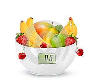 Fruit with in a digital weight scale. Diet concept.