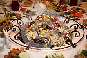 Fruit and flowers on the table, vegetarian holiday table setting