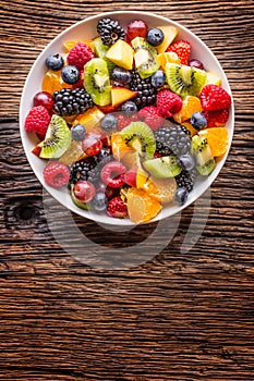 Fruit fresh mixed tropical fruit salad. Bowl of healthy fresh fruit salad - died and fitness concept