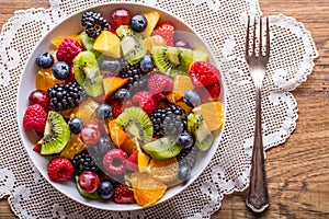 Fruit fresh mixed tropical fruit salad. Bowl of healthy fresh fruit salad - died and fitness concept