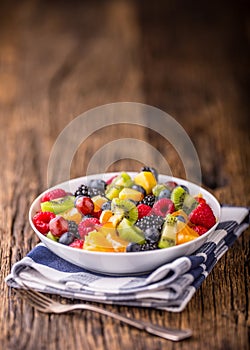 Fruit fresh mixed tropical fruit salad. Bowl of healthy fresh fruit salad - died and fitness concept