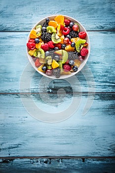 Fruit fresh mixed tropical fruit salad. Bowl of healthy fresh fruit salad - died and fitness concept
