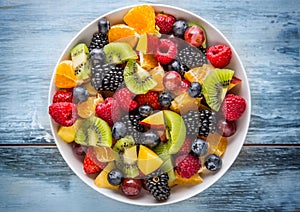 Fruit fresh mixed tropical fruit salad. Bowl of healthy fresh fruit salad - died and fitness concept photo