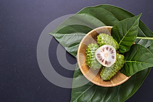 Fruit of Great morinda (Noni) or Morinda citrifolia tree and gre