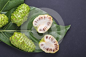 Fruit of Great morinda (Noni) or Morinda citrifolia tree and gre