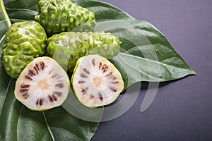 Fruit of Great morinda (Noni) or Morinda citrifolia tree and gre