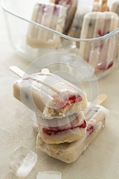 Fruit healthy berry ice cream. Homemade popsicle lolly with strawberries, blueberries and bananas