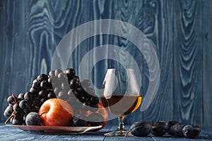 Fruit on her cover look interesting. Cognac served with fruit.