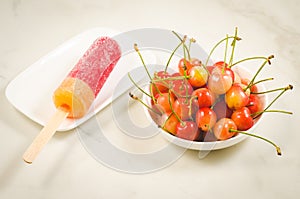 fruit ice cream and bowl with sweet cherry/fruit ice cream and bowl with sweet cherry on a white background